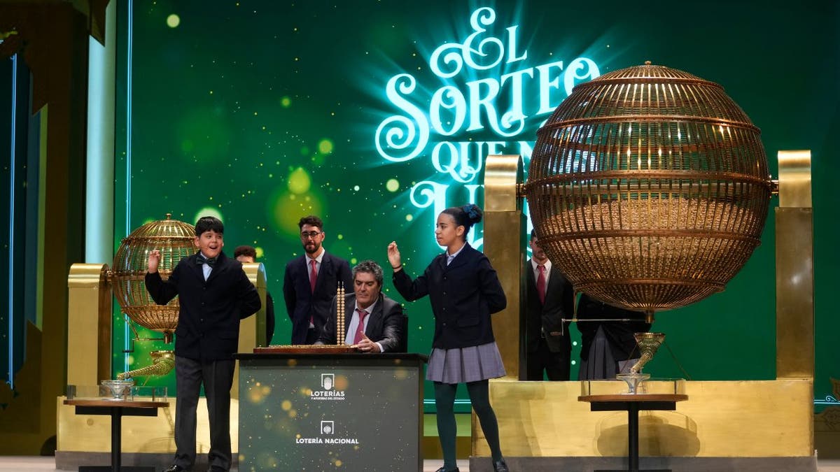 Children at Spain's Christmas lottery sing out the winning numbers