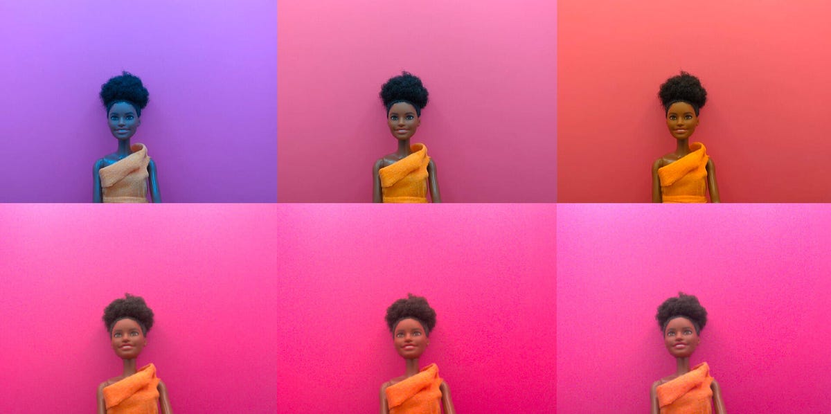 A comparison of color problems photographing a doll with darker skin under different lighting conditions. Three test images on the top show varying and incorrect color; three test images below with Spectricity camera data handle the color problems.