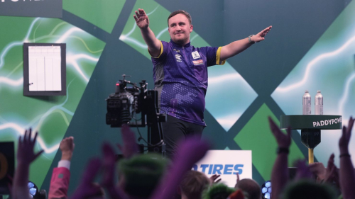 Luke Littler of England, celebrates after winning the quarterfinal match against Brendan Dolan of Northern Ireland at the World Darts Championship, in London, Monday, Jan. 1, 2024. (AP Photo/Kin Cheung)