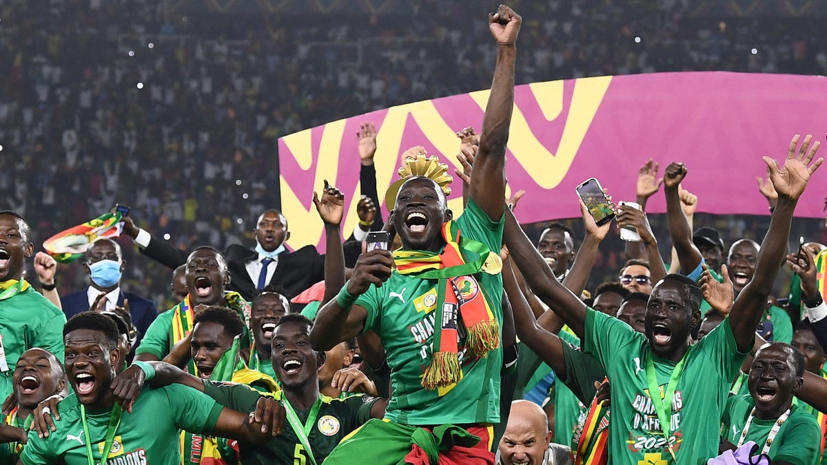 The Senegal squad celebrate winning the 2021 Africa Cup of Nations.