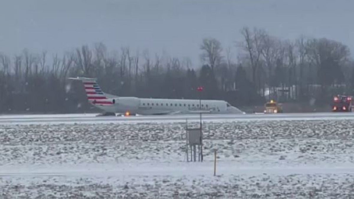 American Airlines planes on a snowy taxiway in New York