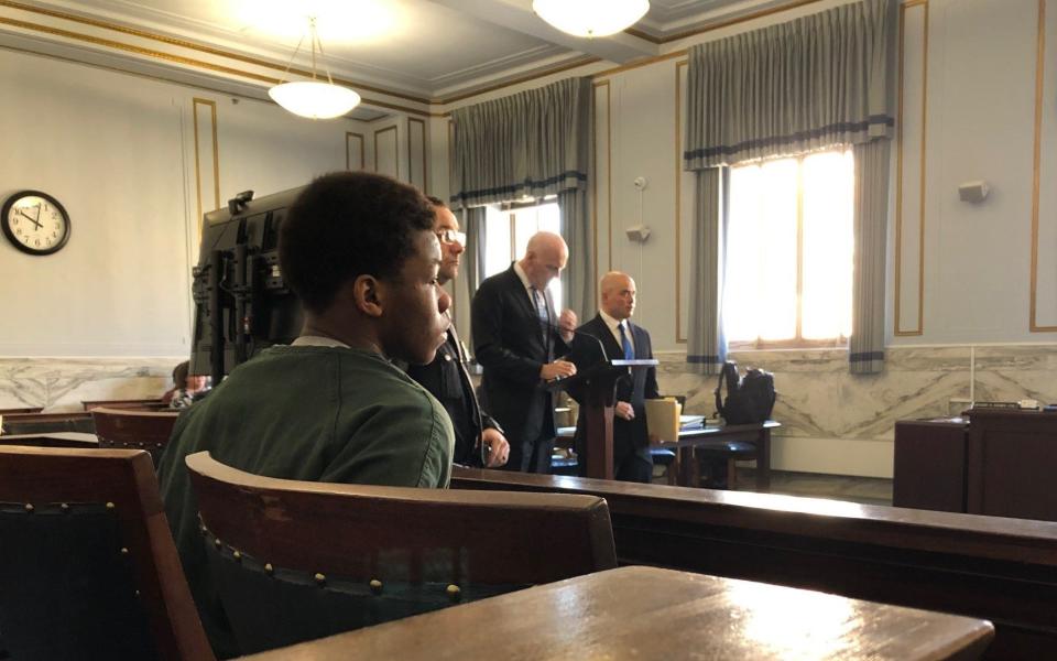 Derrell Bates, seated, waits for a hearing to begin on Feb. 15, 2023 in Hamilton County Common Pleas Court before Judge Robert Goering.