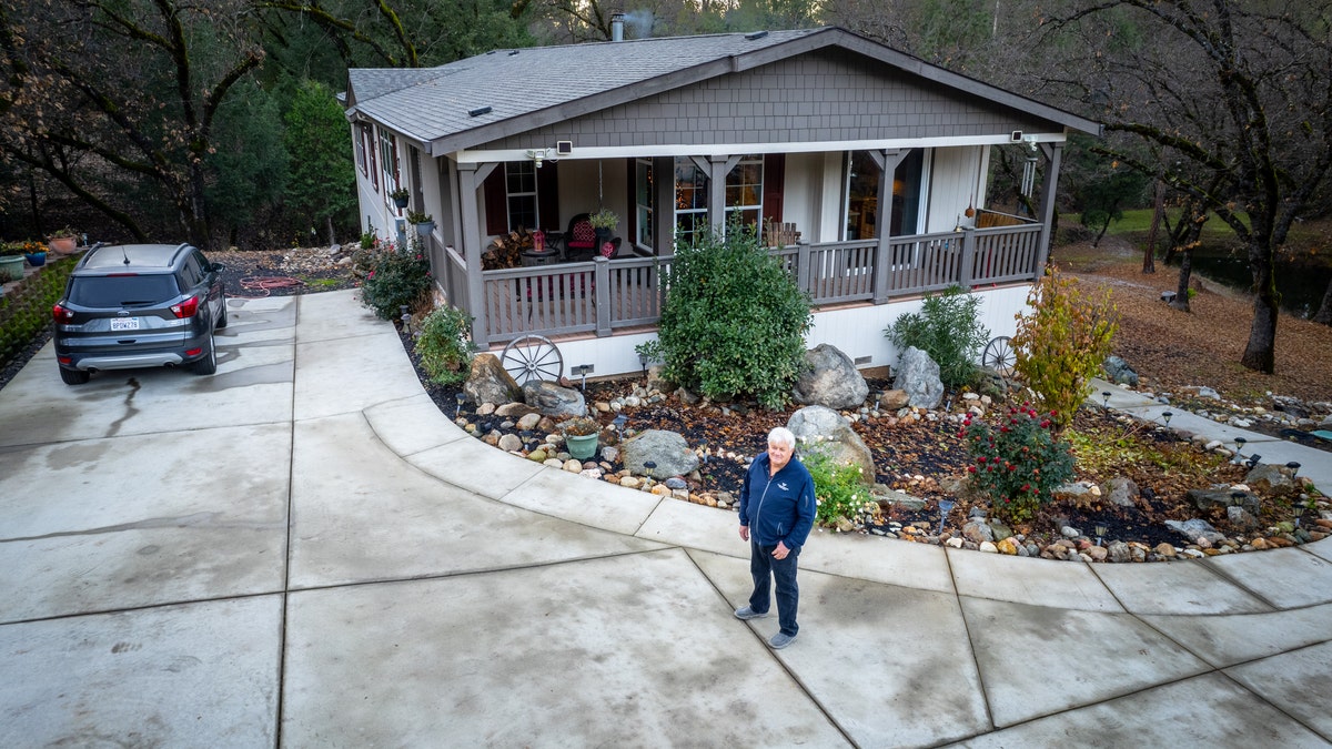 George Sheetz in front of El Dorado County home