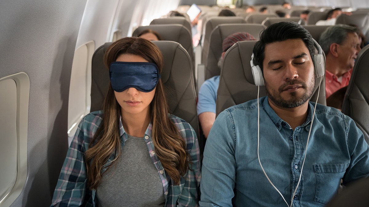 people sleeping on plane