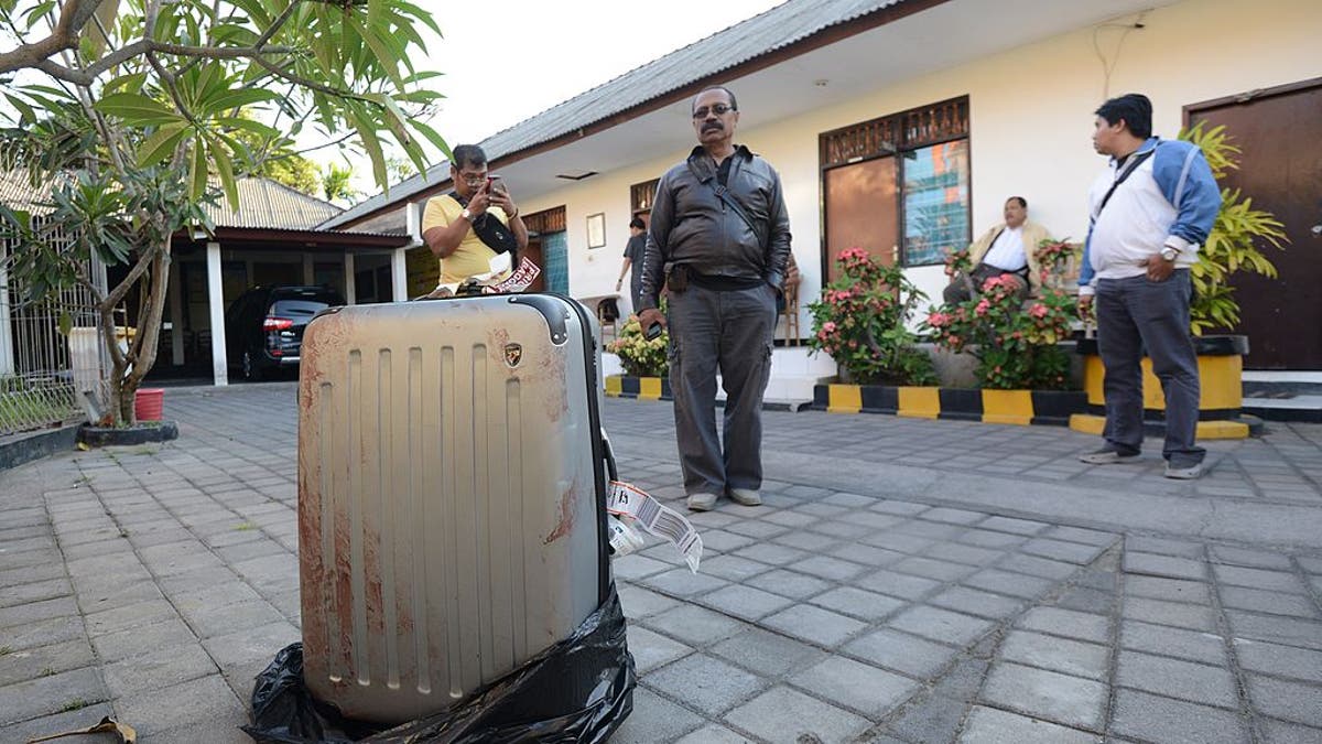 Bloody suitcase in garbage back at St Regis resort in Bali