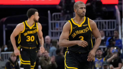 Golden State Warriors guard Chris Paul, right, jogs up the court after scoring against the Detroit Pistons, in front of guard Stephen Curry (30) during the second half of an NBA basketball game in San Francisco, Friday, Jan. 5, 2024.