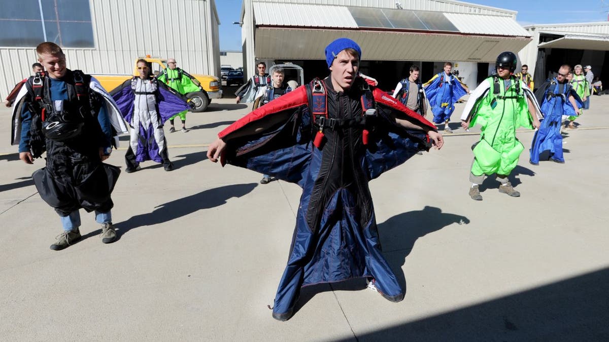 A man directs a group in a formation at Vance Brand Airport and Mile High Skydiving in Longmont in 2012