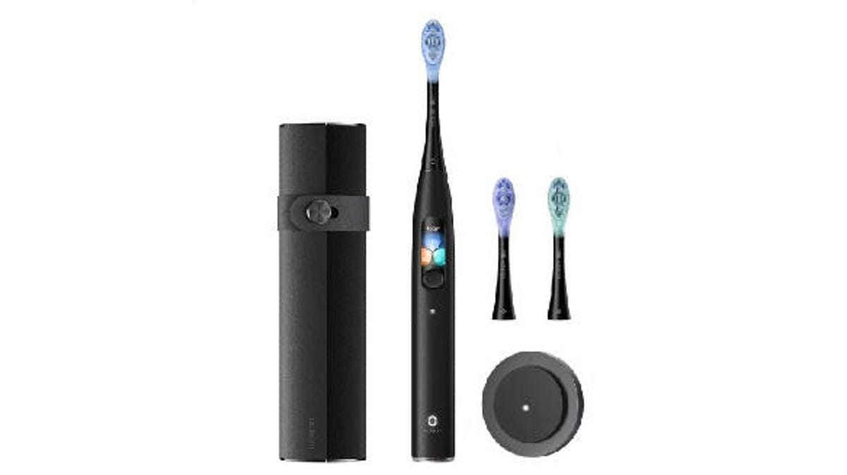 The Oclean X Ultra Wi-Fi Digital Toothbrush with extra heads and charger