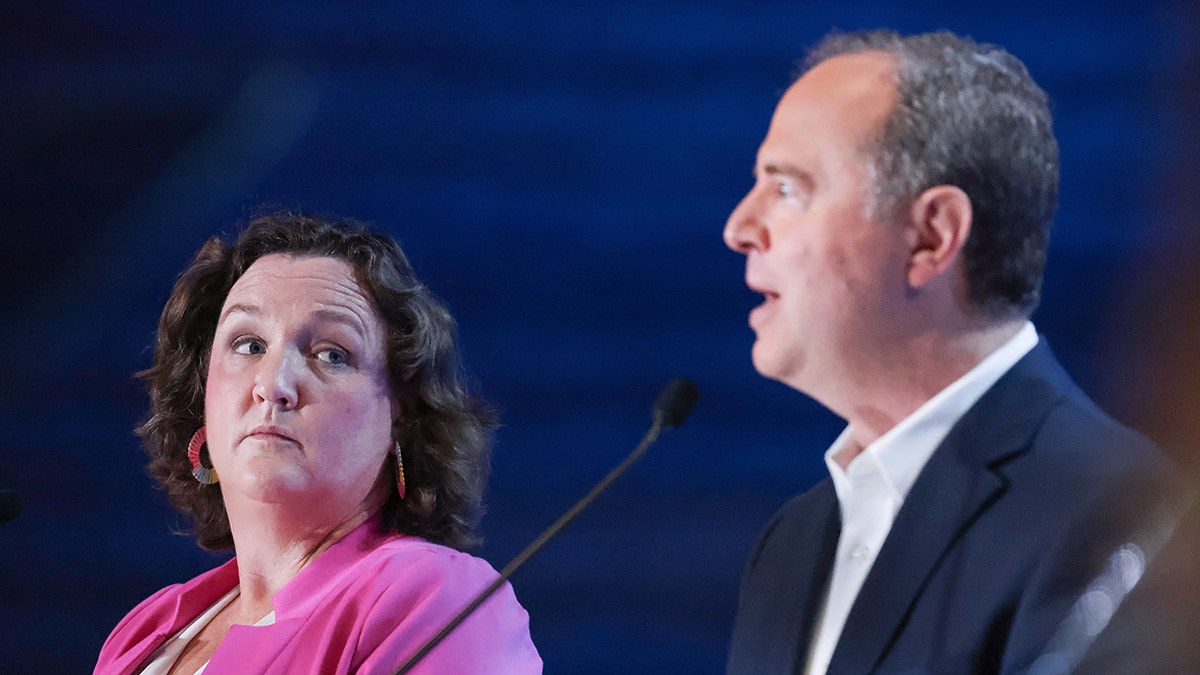 Katie Porter glances at Adam Schiff during a candidate forum on October 8