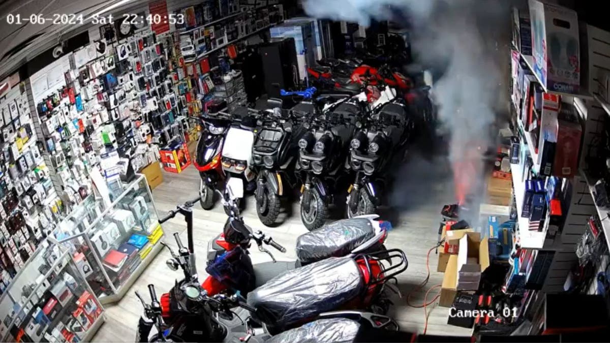 A screenshot showing the moment an e-bike lithium-ion battery catches fire and explodes, burning down a store in Queens.