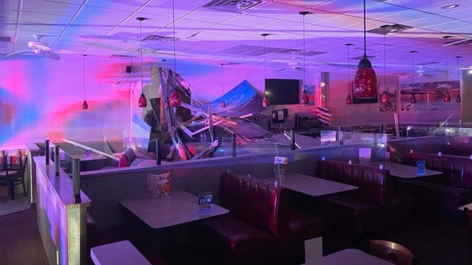 Photos show scene of DUI crash inside Florida strip shopping center