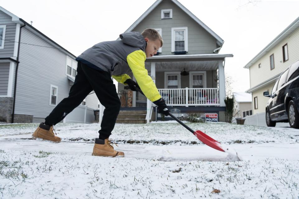 Parker Garofalo, 9 of Rutherford, shovels a little bit of snow from the front of his home before going to school in Rutherford, NJ on Wednesday Feb. 1, 2023.