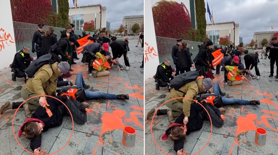 German police officer accused of painting climate protester's face orange