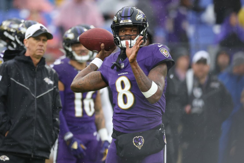 BALTIMORE, MARYLAND - DECEMBER 10: Lamar Jackson #8 of the Baltimore Ravens warms up prior to the game against the Los Angeles Rams at M&T Bank Stadium on December 10, 2023 in Baltimore, Maryland. (Photo by Todd Olszewski/Getty Images)