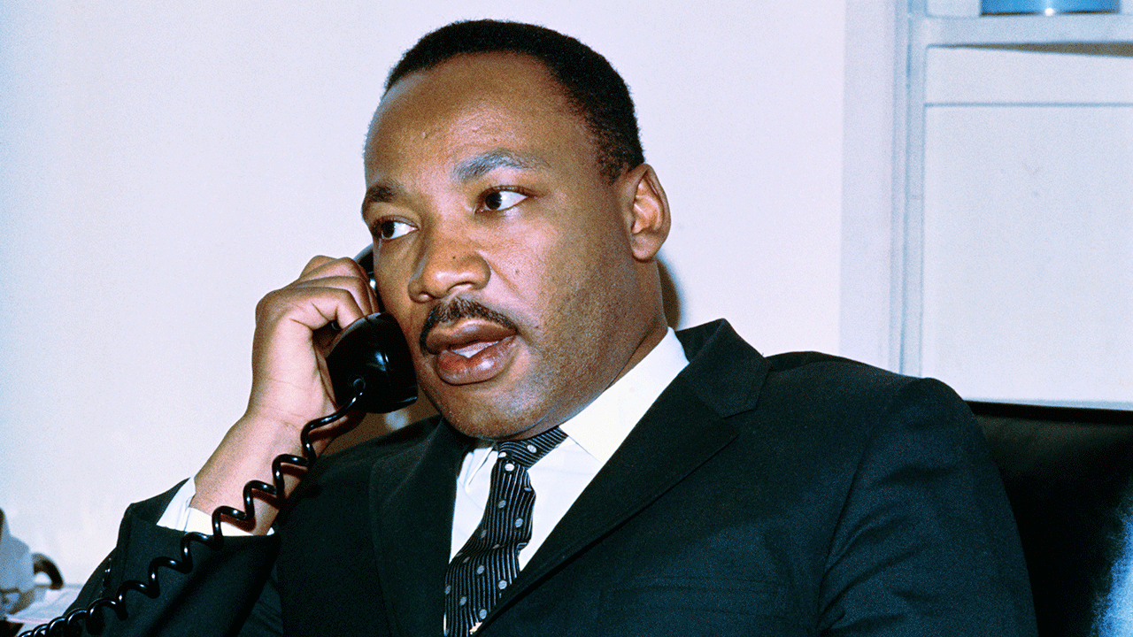Martin Luther King Jr. speaking on the telephone
