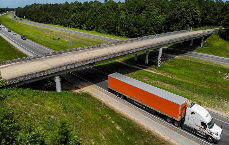 A semi-tractor trailer passes underneath the Purrysburg Road overpass on Monday as it travels northbound on Interstate 95 into Hardeeville town limits. This is the site where the developer of River Port Business Park, City of Hardeeville and Jasper County want a new interchange that will connect to U.S. 17 and U.S. 321 in Jasper County.