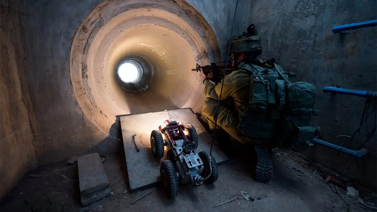 IDF soldier looks down a tunnel built by Hamas.
