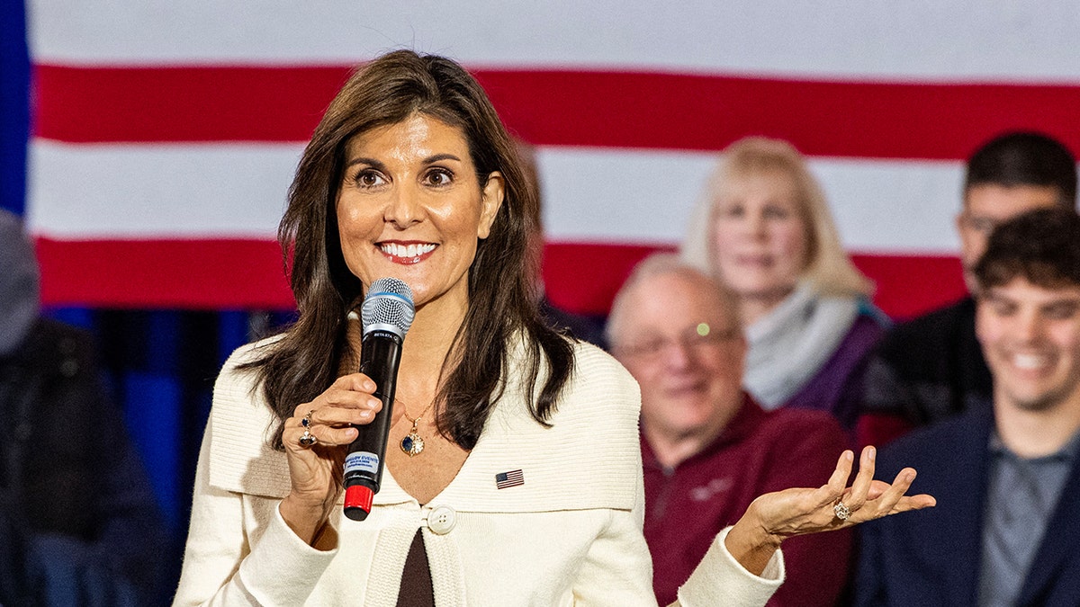Nikki Haley holding microphone at campaign event
