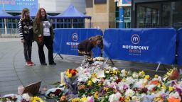 People lay flowers and messages in tribute to Nottingham Panthers' ice hockey player Adam Johnson outside the Motorpoint Arena in Nottingham, the home of the Panthers. Mr Johnson died after an accident during a Challenge Cup match with Sheffield Steelers on Saturday night. Picture date: Monday October 30, 2023. (Photo by Jacob King/PA Images via Getty Images)