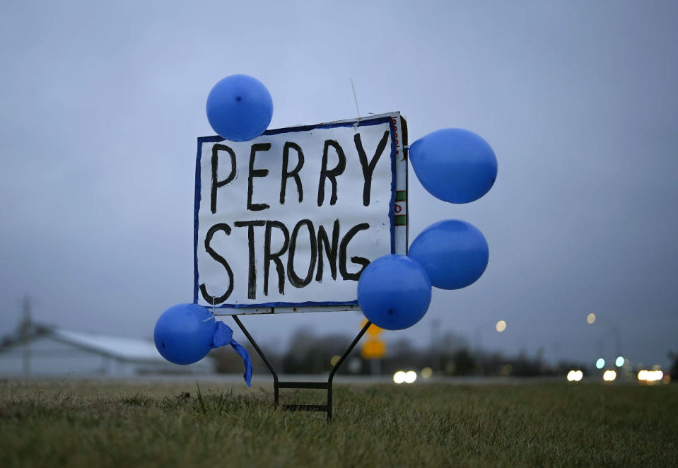 A sign along Highway 141 in Granger, Iowa, shows support for the neighboring community of Perry on Friday after a shooting at the Perry Middle School and High School building Thursday. (Bryon Houlgrave / AP)