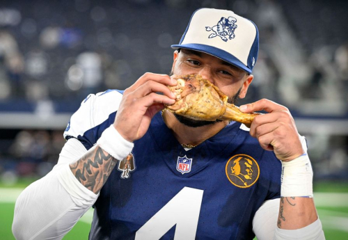 Dallas Cowboys quarterback Dak Prescott eats a turkey leg after the Cowboys' 45-10 Thanksgiving Day victory over the Washington Commanders on November 23.