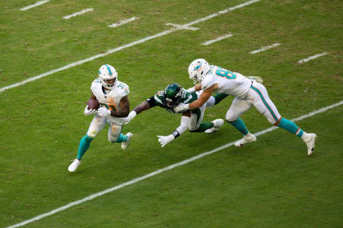 Miami Dolphins running back Raheem Mostert runs the ball during a the team's 30-0 win against the New York Jets.
