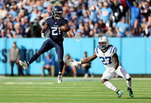 Roger McCreary of the Tennessee Titans and Indianapolis Colts running back Trey Sermon attempt to catch the ball. The Colts beat the Titans 31-28 in overtime.