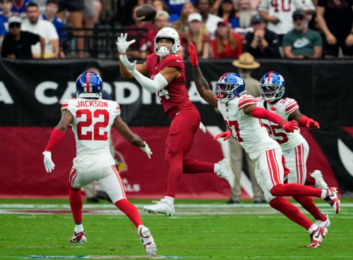 Arizona Cardinals wide receiver Michael Wilson makes a catch over New York Giants safety Jason Pinnock at State Farm Stadium. The Cardinals narrowly lost 31-28.