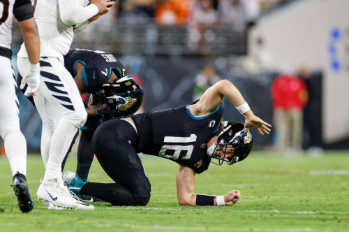 Jacksonville Jaguars quarterback Trevor Lawrence reacts after suffering an injury during the Jaguars' 34-31 loss to the Cincinnati Bengals on Monday, December 4.