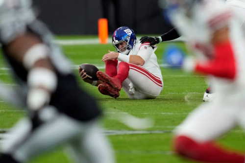 New York Giants quarterback Daniel Jones grimaces after being sacked during the Giants' 30-6 loss to the Las Vegas Raiders.