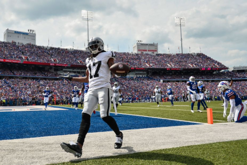Las Vegas Raiders wide receiver Davante Adams celebrates after scoring the team's only touchdown during their 38-10 loss to the Buffalo Bills at Highmark Stadium.
