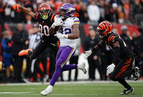 Minnesota Vikings running back Ty Chandler carries the ball. The Vikings lost to the Cincinnati Bengals 27-24 in overtime.