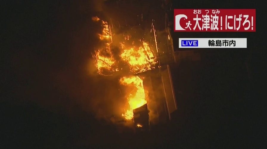 Japan earthquake blamed for fire as country issues tsunami warnings
