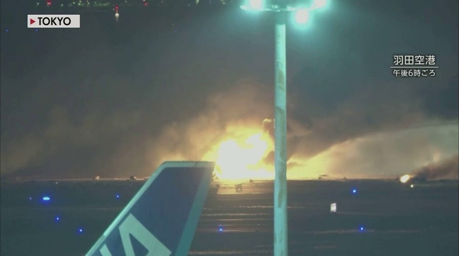 Japanese Airlines jet erupts in flames at Tokyos Haneda airport