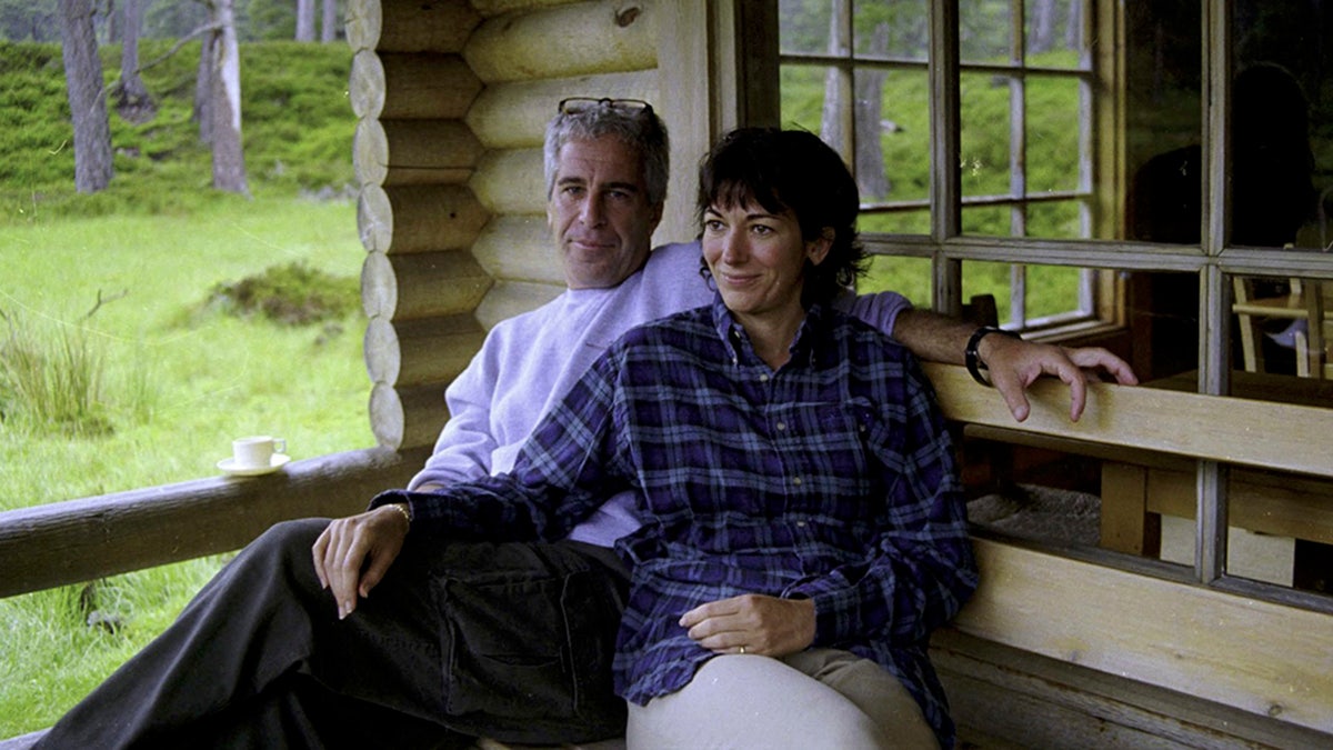 Ghislaine Maxwell and Jeffrey Epstein smile in this undated photograph