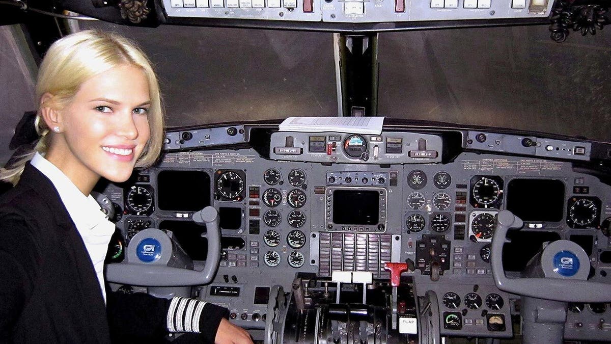 Nadia Marcinkova in an airplane cockpit.