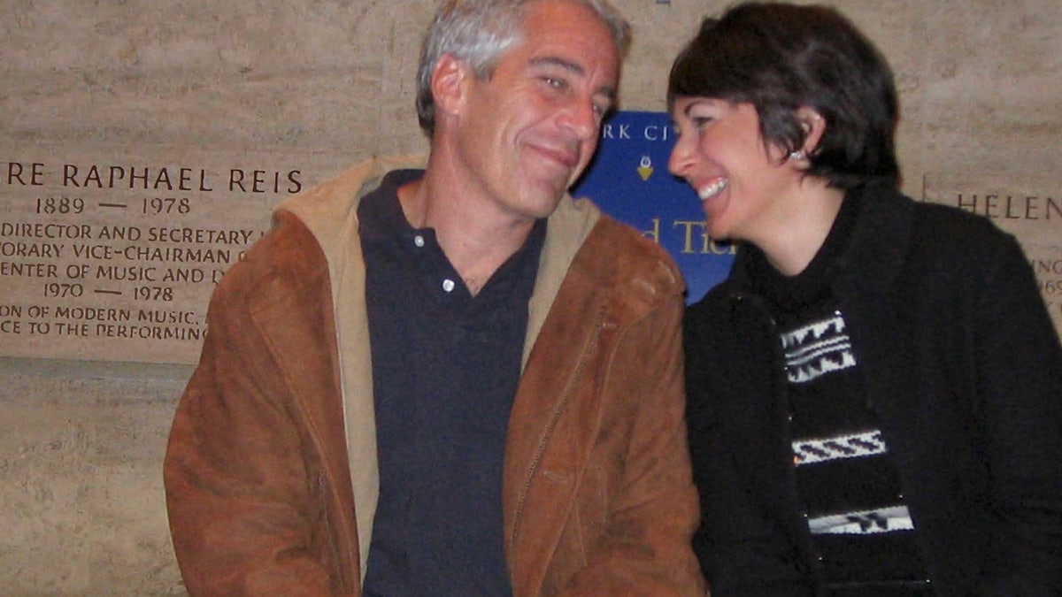 Ghislaine Maxwell and Jeffrey Epstein smile in this undated photograph