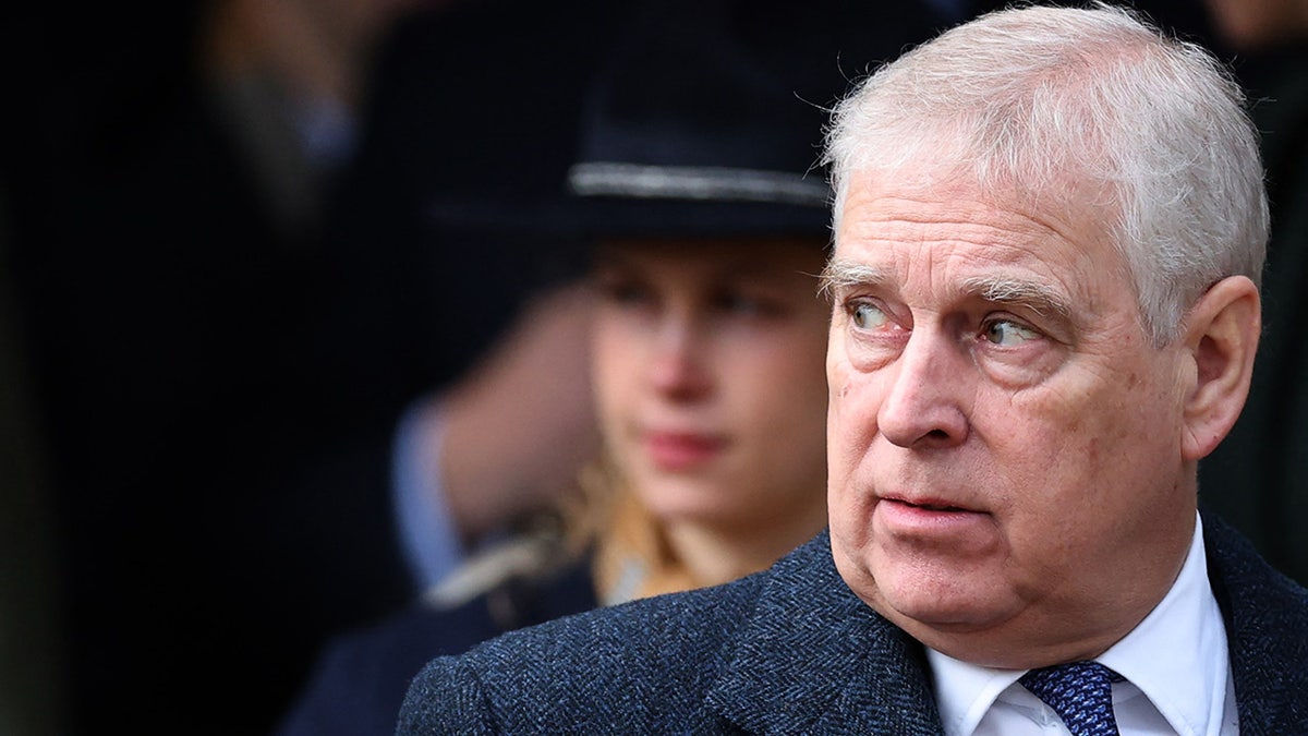 Prince Andrew looking away and appearing serious