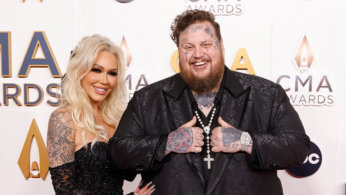 Bunnie XO and Jelly Roll posing together on the red carpet