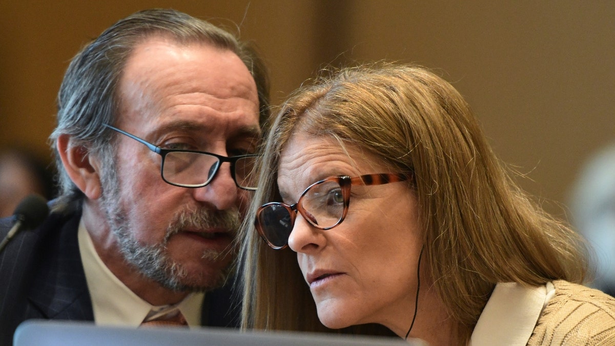 Michelle Troconis, right, consults with her defense attorney, Jon Schoenhorn, on day nine of her criminal trial at Connecticut Superior Court in Stamford, Conn., Wednesday, Jan. 24, 2024.
