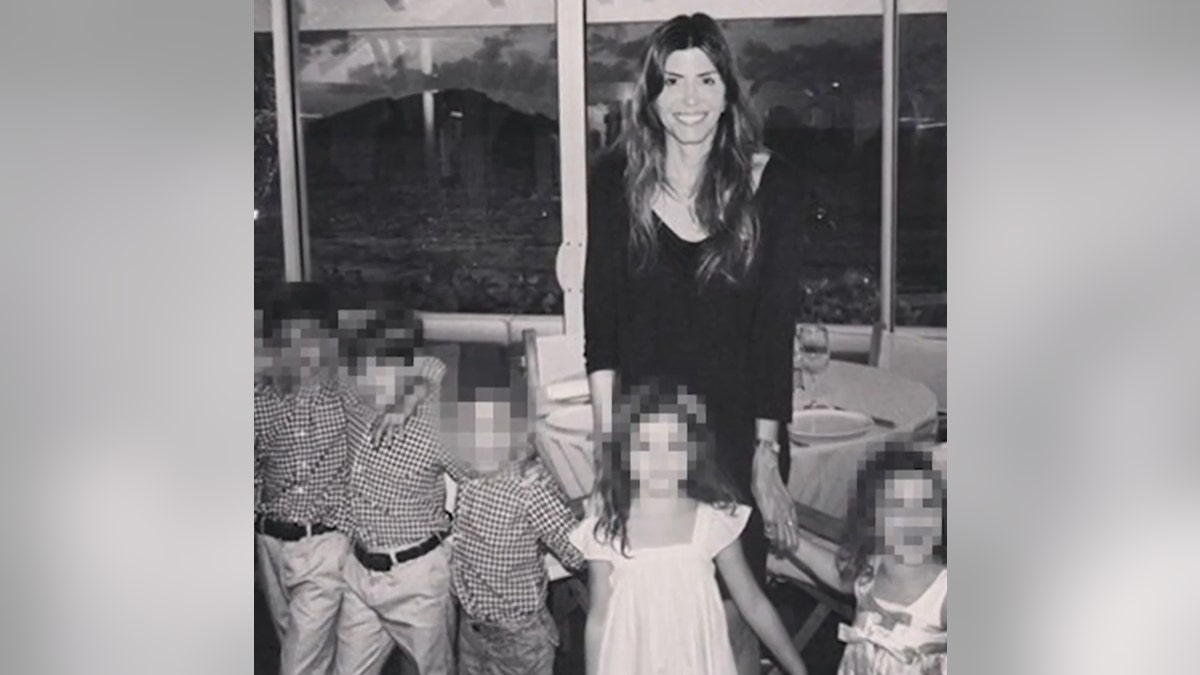 Jennifer Dulos poses with her five children