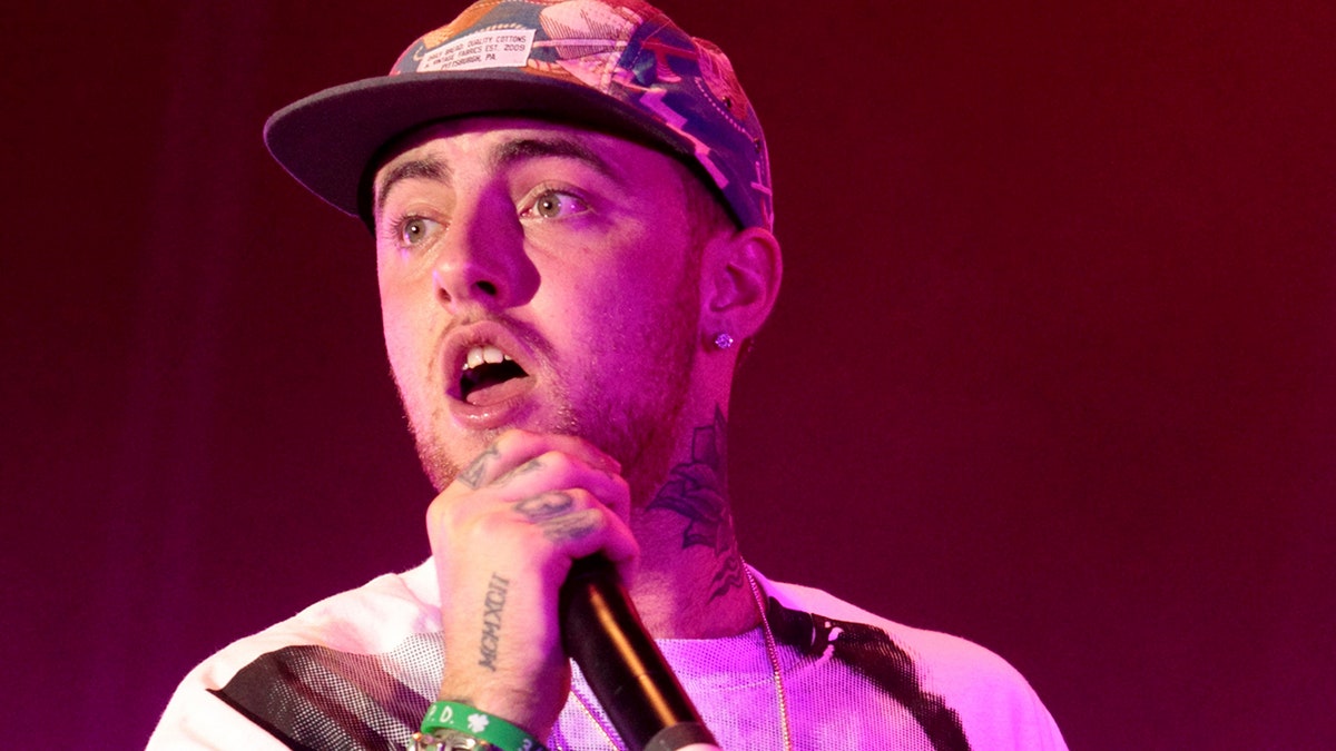 FILE - In this July 13, 2013 file photo, rapper Mac Miller performs on his Space Migration Tour at Festival Pier in Philadelphia. Miller, the platinum hip-hop star whose rhymes vacillated from party raps to lyrics about depression and drug use, has died at the age of 26. A family statement released through his publicists says Miller died Friday, Sept. 7, 2018, and there are no further details available on how he died. (Photo by Owen Sweeney/Invision/AP, File)