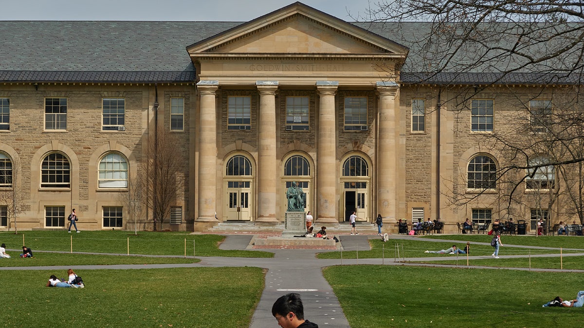 Cornell campus building and grounds with students