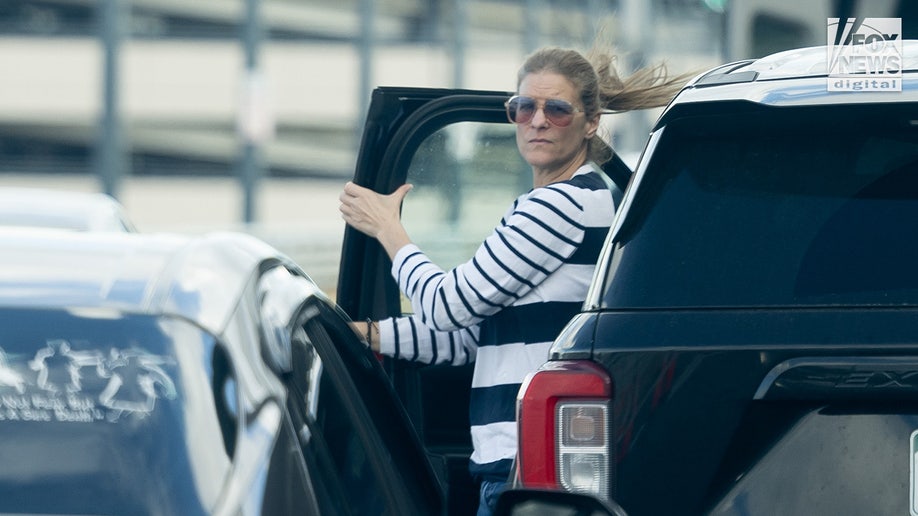 Michelle Troconis exits vehicle
