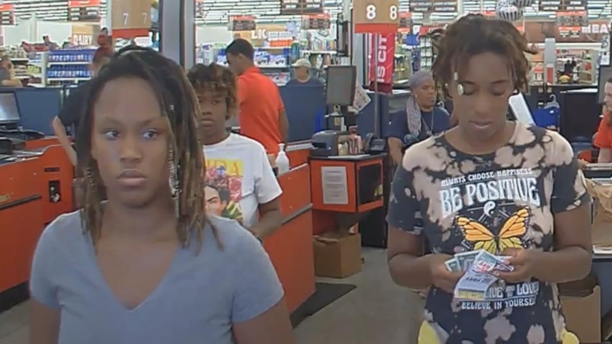 Mikayla Thompson, 25, of St. Louis; Gerrielle German, 27, of Lake Horn, Mississippi; amd Ma’Kayla Wickerson, 36, of St. Louis shop at a grocery store.