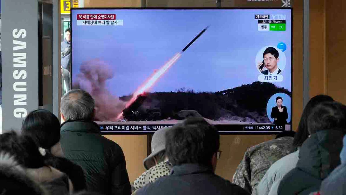 TV screen shows a file image of North Koreas missile launch