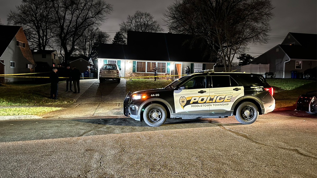 Middletown Township Police outside of a home