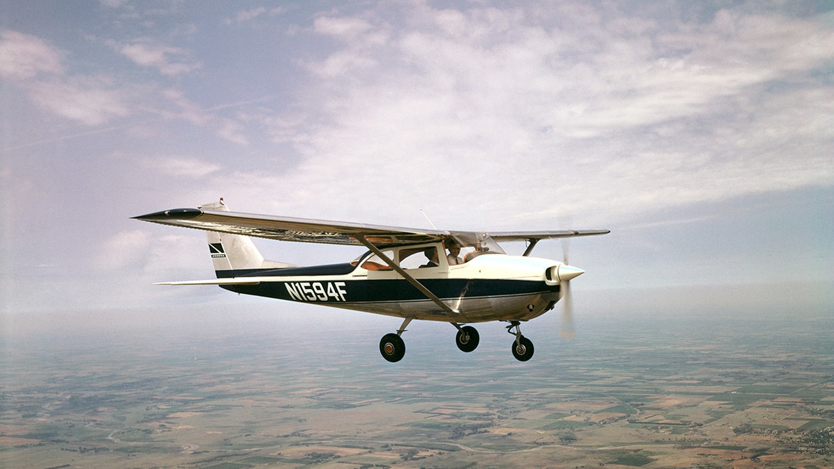 A photo of a Cessna 172 flying
