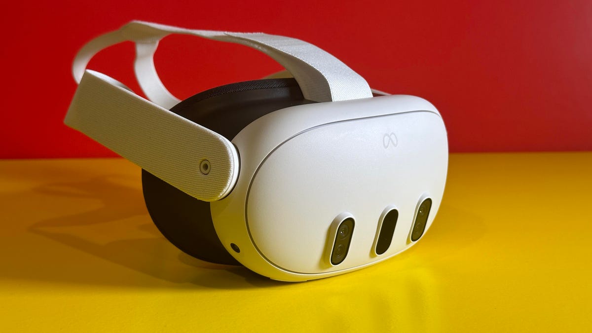 A VR headset, the Quest 3, on a yellow table