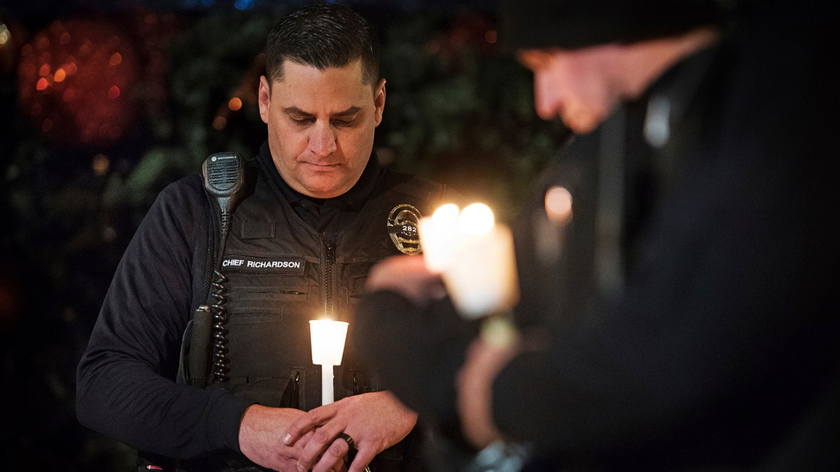 Police at candlelight vigil